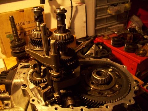 1995 Ford Probe - Close-up of internal transmission components, including gears and shafts, with a "MADE IN JA" box visible.