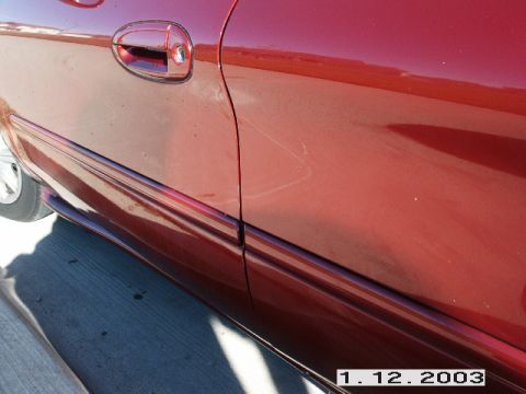 1998 Mercury Sable - Red car side panel and door detail with a watermark at the bottom right.