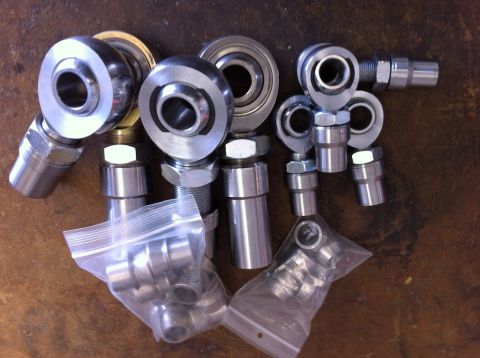 1987 Suzuki Samurai - Collection of various rod ends and bearings, some still in plastic packaging.