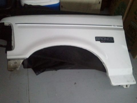 1994 Ford Bronco - White Ford Bronco XLT fender, detached from the vehicle.