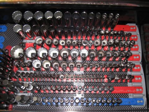 2000 Ford Crown Victoria - A collection of sockets and wrenches neatly organized in a tool case.