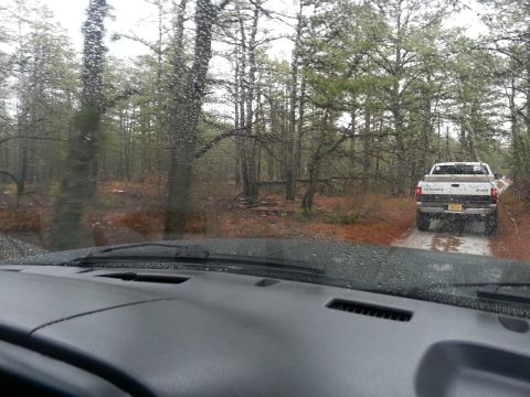 1987 Toyota 4Runner - Driving through Wharton State Forest with another truck ahead on a muddy path.