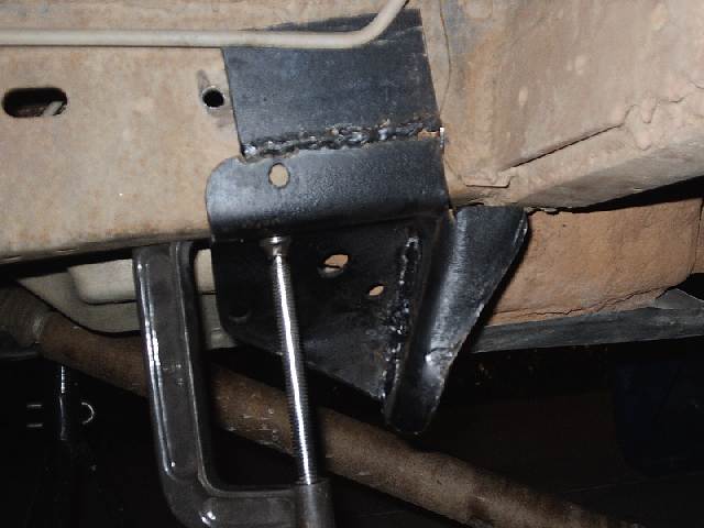 Held on with a c-clamp, the bracket looks like it it good to get drilled