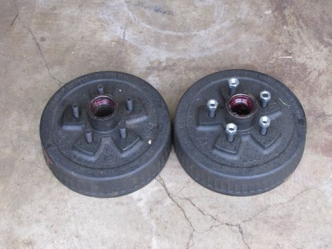 1995 Ford Bronco - Pair of trailer brake drums shown on concrete, ready for installation or sale.