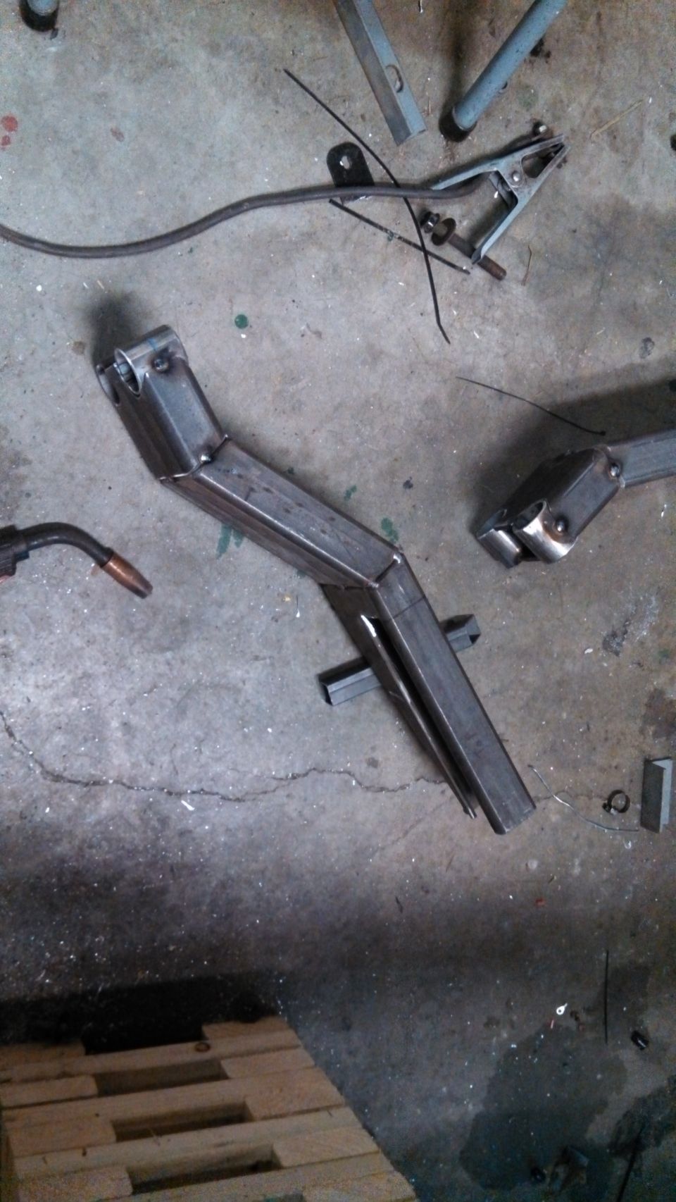 Metal frame part with welded joints on a concrete floor