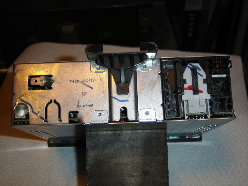 Back of car stereo unit with part number F42F-18K817-XB and date 03-07-95 stamped