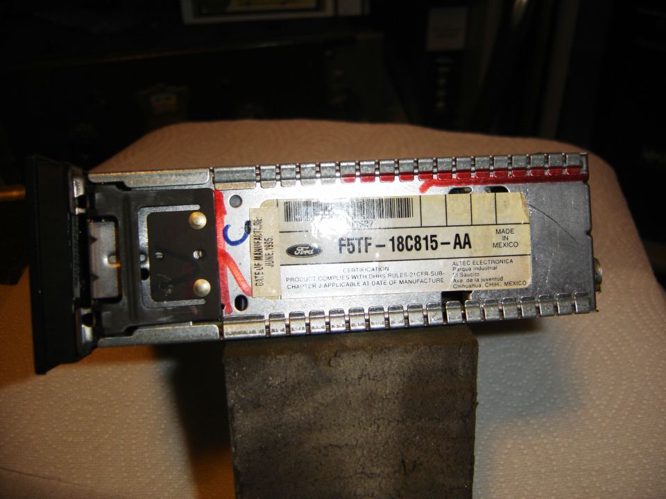 Car stereo with "DATE OF MANUFACTURE JUNE 1995" label