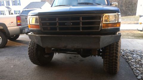 1995 Ford Bronco - Custom bumper installed on the front of a 1995 Ford Bronco, showing the grille and headlights.