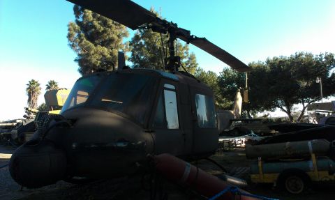 1994 Ford Bronco - This helicopter is parked outdoors, with trees and a clear blue sky in the background.