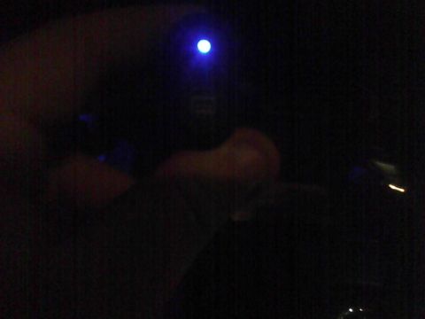 2003 Ford Crown Victoria - A blue light is visible in the dark interior of a vehicle.