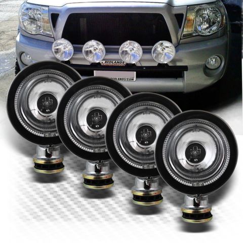 1992 Ford Bronco - Aftermarket fog lights are shown mounted on the front of a silver truck, obscuring the grille and bumper details.