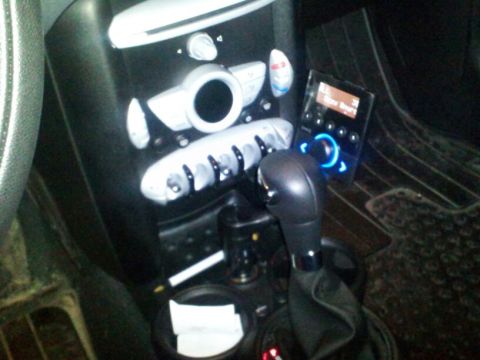 2010 MINI Cooper - Interior view of a 2010 MINI Cooper, highlighting the center console and infotainment system.