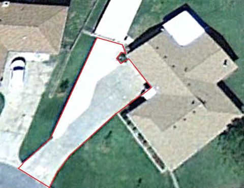 1965 Ford Mustang - An aerial view shows a house with a red outline marking its driveway and a portion of the adjacent property.