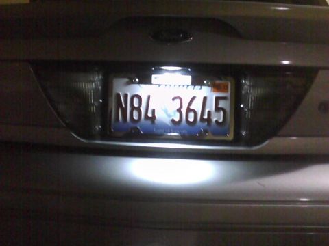 2003 Ford Crown Victoria - The rear of a 2003 Ford Crown Victoria is visible, displaying the license plate N84 3645.