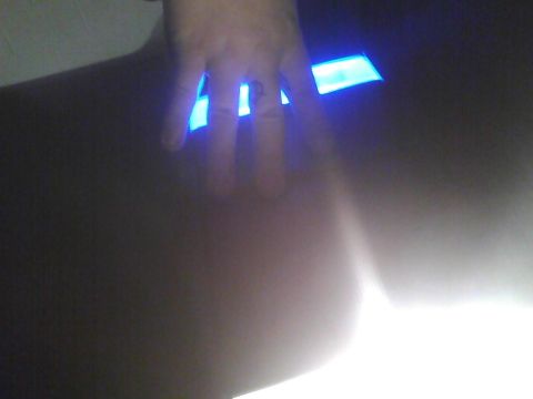 2003 Ford Crown Victoria - Interior shot showing a hand with a ring illuminated by blue lights.