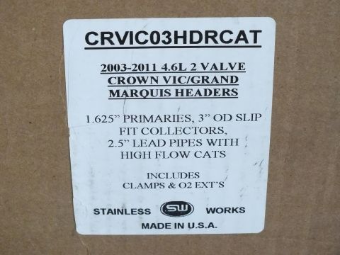 2003 Ford Crown Victoria - Product box label for Stainless Works Crown Vic/Grand Marquis headers listing primary sizing and included parts, not a vehicle technical do…