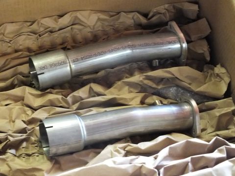 2003 Ford Crown Victoria - Pair of polished stainless lead pipes showing laser-etched part markings, packed in kraft paper.