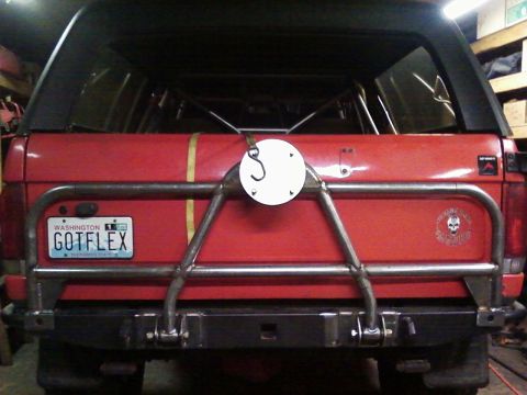 1989 Ford Bronco - Rear view of a 1989 Ford Bronco a custom tire carrier and aftermarket bumper.
