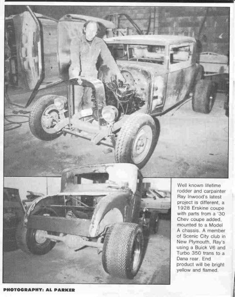 1969 Lincoln Continental - A hot rod project car is shown with a man working on the engine, and another car in the background.