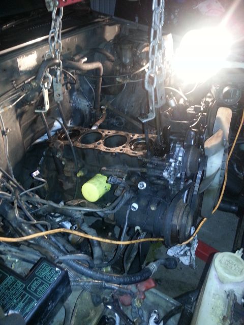 1987 Toyota 4Runner - Engine removal in progress, with chains supporting the powerplant.