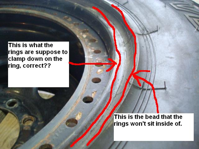 Close-up of a tire bead not seating on a wheel rim, with red lines indicating the issue