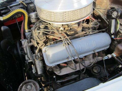 1957 Ford Ranchero - Close-up view of a Ford engine bay, highlighting the valve covers and air filter assembly.