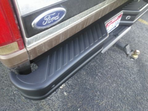 1992 Ford Bronco - Rear view of a 1992 Ford Bronco, showing the bumper, Ford emblem, and trailer hitch.