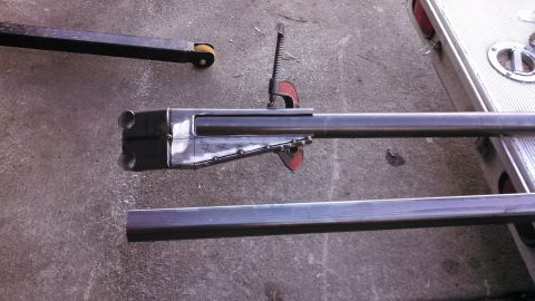 1967 Ford F-250 - A fabricated metal part with a double-barreled end is clamped in place for work.