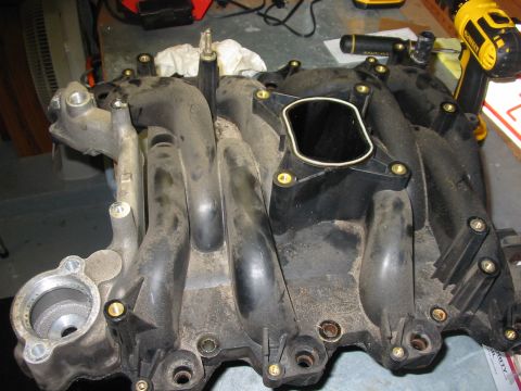 2003 Ford Crown Victoria - upper intake from my 2003 CV, replaced at 100K due to cracks in the coolant passages. It was leaking a small amount of coolant from the dri…