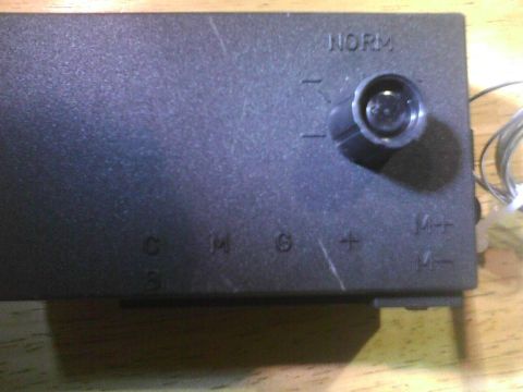 2003 Ford Crown Victoria - Close-up of an electronic control module with various settings and a rotary dial.