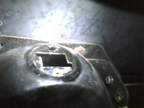 2003 Ford Crown Victoria - A close-up view of a vehicle component, possibly from the interior or engine bay, with a visible Supermotors.net watermark.