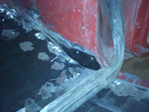 1978 Ford Bronco - Welding repairs visible on a vehicle's body panel, indicating bodywork in progress.