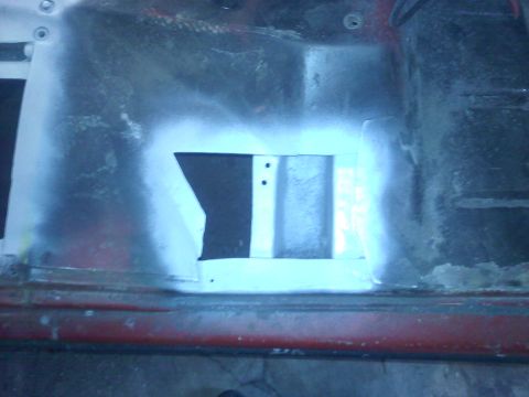 1978 Ford Bronco - A close-up view of a metal panel with a cutout, showing signs of repair or modification.