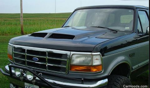 1994 Ford Bronco - Front view of a Ford F-Series truck, likely from the early to mid-1990s, with a custom hood scoop.