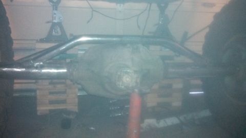 1967 Ford F-250 - Close-up of a vehicle's rear axle assembly, possibly undergoing modifications or repairs.