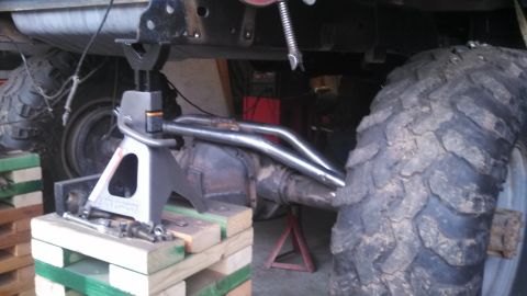 1967 Ford F-250 - Close-up view of a truck's undercarriage, showing the rear axle and exhaust system.