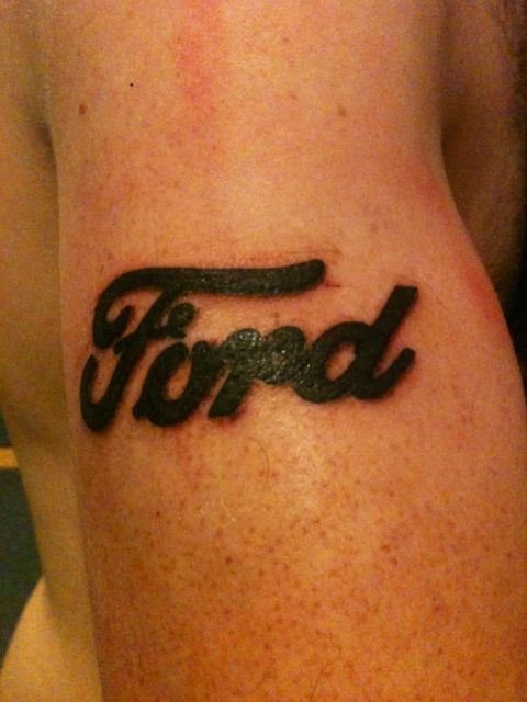 2004 Ford Crown Victoria - Tattoo of the Ford logo on a person's arm.