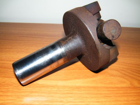 2004 Ford Crown Victoria - Close-up of a driveshaft U-joint part, showing wear and rust.