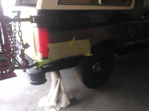 1992 Ford Bronco - Rear view of a 1992 Ford Bronco, showing the taillight and wheel.