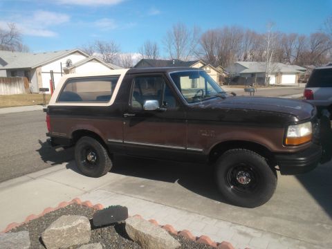 1992 Ford Bronco - This 1992 Ford Bronco is shown from the front three-quarter view in a residential setting.