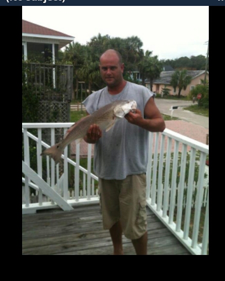 1986 Ford Bronco - A man proudly displays a large fish he has caught while standing on a wooden deck with a house in the background.
