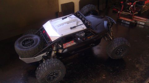 1996 Ford Bronco - This remote-controlled rock crawler features a roll cage and exposed internal components.