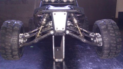 1996 Ford Bronco - Close-up view of the front suspension and large tires on an RC car.