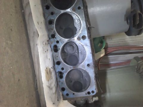 1979 Ford Bronco - Close-up view of an engine cylinder head, showing internal components.
