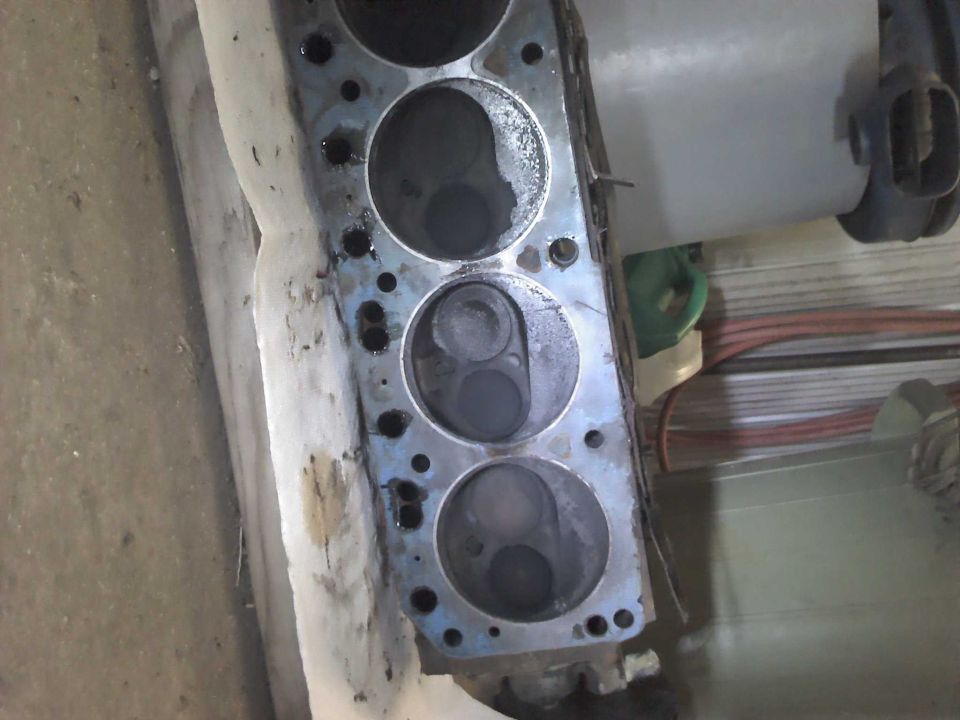 Engine cylinder head with visible cylinders and valves