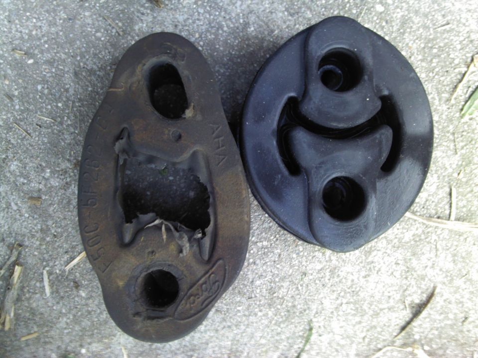 Old and new exhaust hangers, one with Ford logo