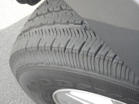 2011 Jeep Liberty - Tire detail shot showing tread pattern and partial sidewall markings.