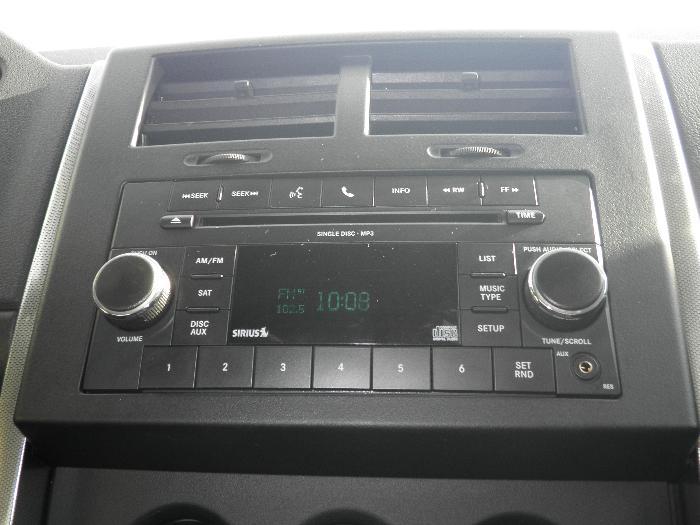 Dashboard with radio, air vents, and controls. Shows time 10:08