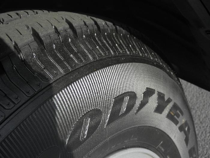 Close-up of a Goodyear tire on a 2011 Jeep Liberty.