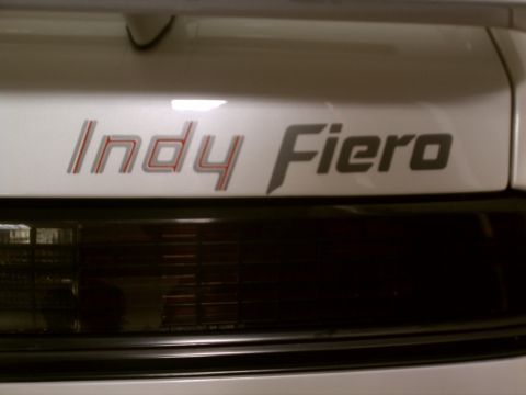 1998 Toyota Camry - Close-up of the 'Indy Fiero' emblem on the rear of a vehicle.